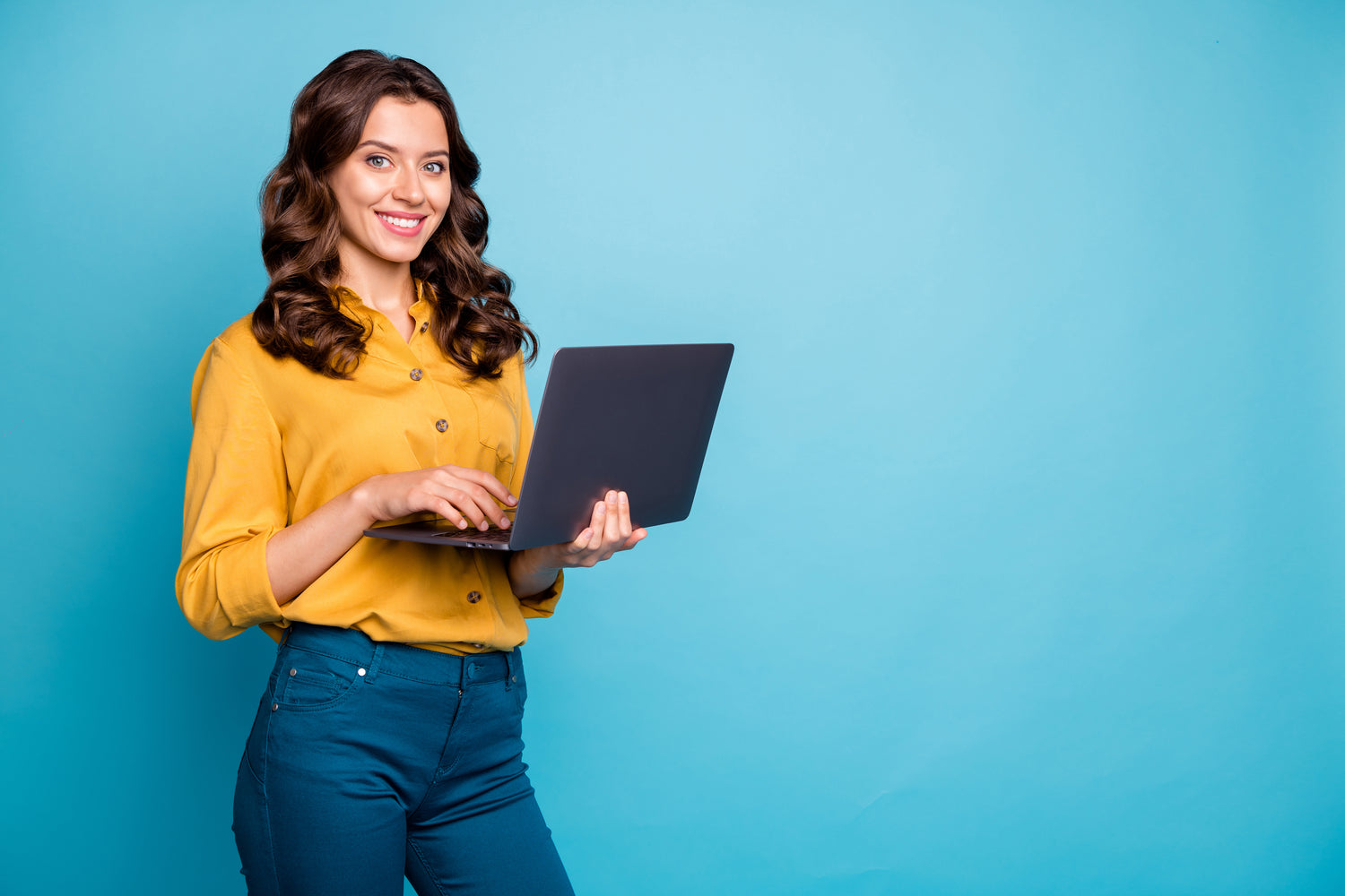 Woman holding laptop computer